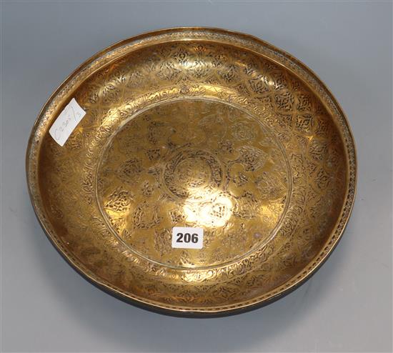 A Persian engraved brass bowl, c.1800 diameter 33.5cm
